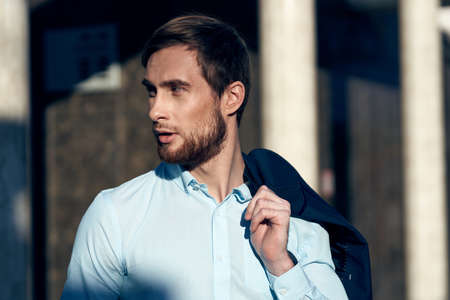 business man a jacket on the shoulders of the street professionals self-confidenceの写真素材