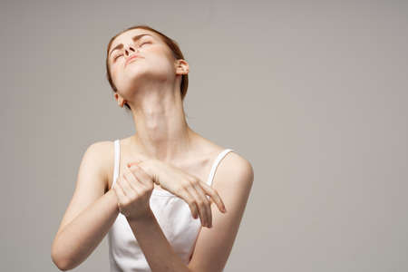 woman holding on to the arm health problems joint studio treatmentの写真素材