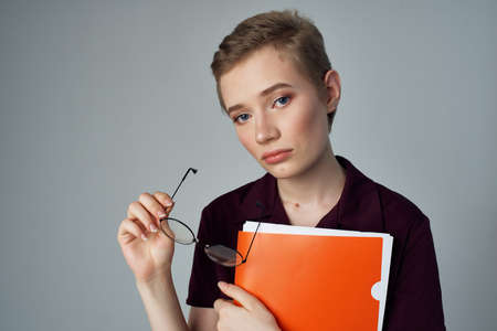short haired woman in a red shirt classic style isolated backgroundの写真素材