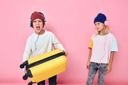 Portrait of a girl and a boy preparing for the holidays young travelers Childhood lifestyle conceptの写真素材