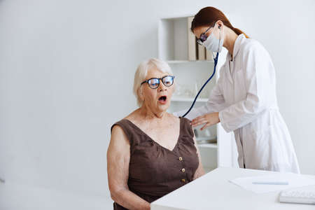 elderly woman patient hospital examination health careの写真素材