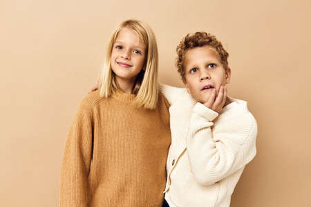 cute stylish kids hugs laughter friendship beige background