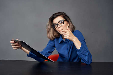 Business woman sitting at the table Papers folder Copy Space managerの写真素材