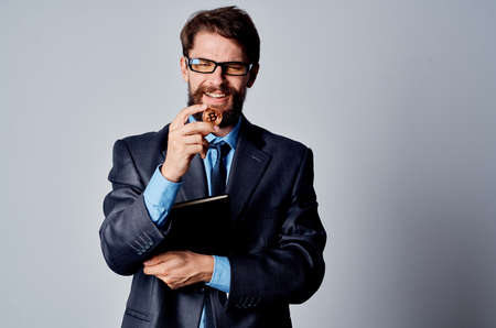 bearded business man in suit cryptocurrency bitcoin internet money financeの写真素材