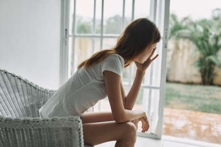 woman at home depression dissatisfaction loneliness interiorの写真素材