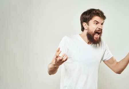 bearded man emotions anger discontent light backgroundの写真素材