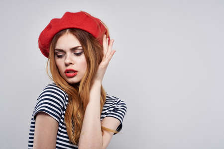 pretty woman posing fashion attractive look red earrings jewelry isolated backgroundの写真素材
