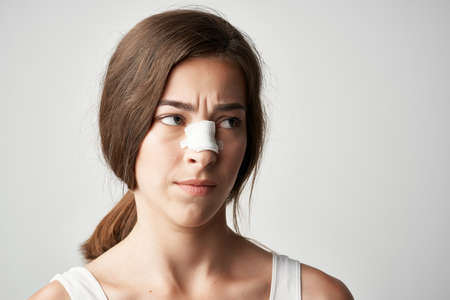 woman with damaged nose injury treatment health medicineの写真素材