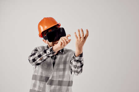 male builder in an orange helmet technology Professional isolated background