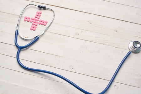 stethoscope medicine hospital pills wooden backgroundの写真素材
