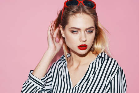 pretty woman in striped shirt sunglasses fashion glamor bright makeupの写真素材