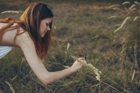 woman in white dress Outdoors summer nature strollの写真素材