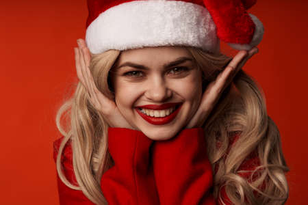 cheerful woman christmas holiday party santa hatの写真素材