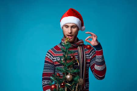 handsome man in New Years clothes decoration christmas studio posing