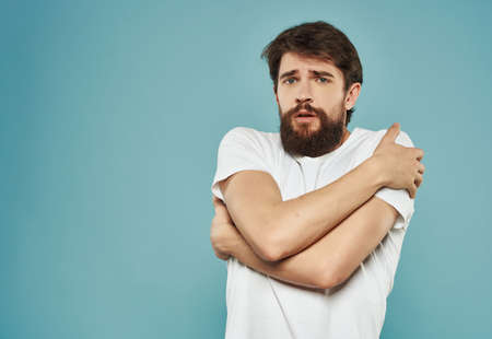 Man in a white t-shirt irritated facial expression Studioの写真素材