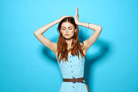 pretty woman in a dress and glasses hairstyle posing Studio funの写真素材