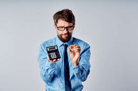 business man calculator cryptocurrency bitcoin electronic moneyの写真素材