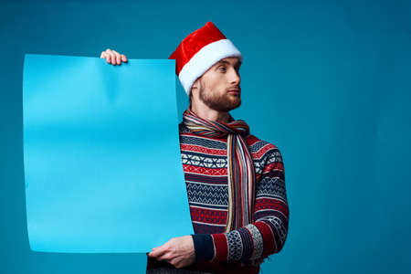 handsome man in a christmas blue mockup Poster studio posingの写真素材