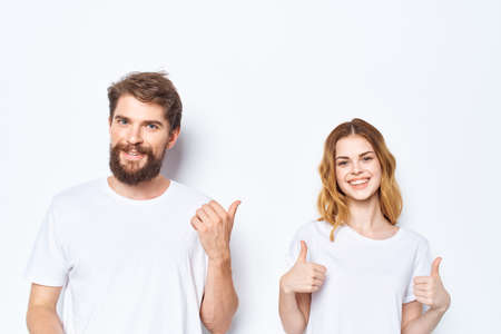 man and woman wearing white t-shirts fashion casual wear friendship togetherの写真素材