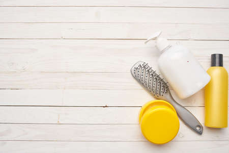 cosmetic cream comb skin care wooden backgroundの写真素材