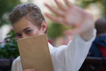short haired woman reading walk in the fresh air educationの写真素材