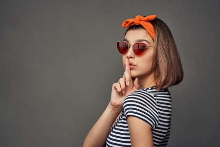 woman wearing sunglasses with bandage on head fashion modern style isolated backgroundの写真素材