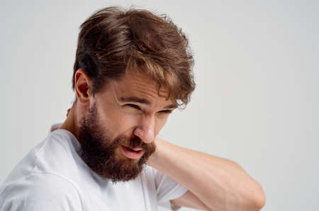 bearded man pain in the neck health problems massage therapy studio treatment