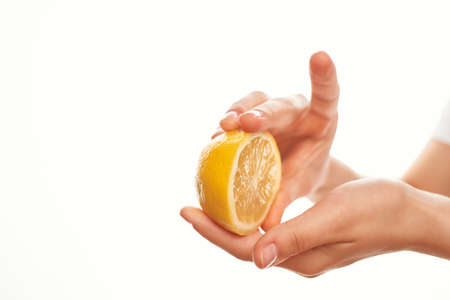 lemon in hand kitchen organique salad ingredientの写真素材