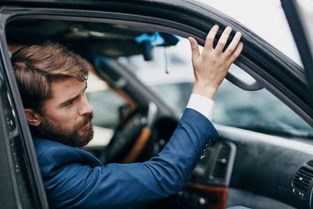 business man rides in car taxi riding service transportationの写真素材