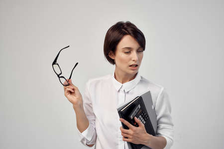 female manager documents Professional Job light backgroundの写真素材