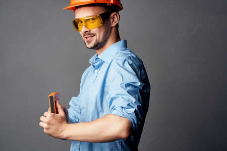 man in orange hard hat Builder emotions Professionalの写真素材
