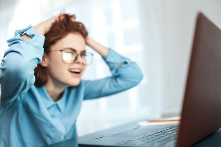 woman student sitting in laptop emotions work learningの写真素材