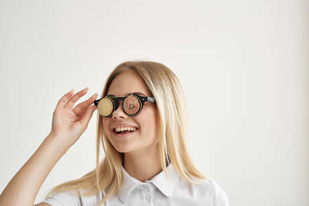 Businesswoman Bitcoin glasses light backgroundの写真素材
