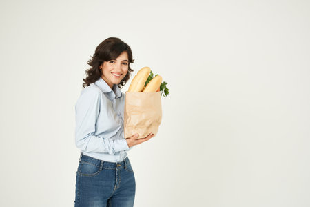 woman autumn shirts i am a housewife package with groceries in the supermarket deliveryの写真素材