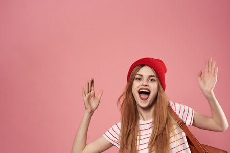 cheerful fashionable woman in red hat summer style posingの写真素材