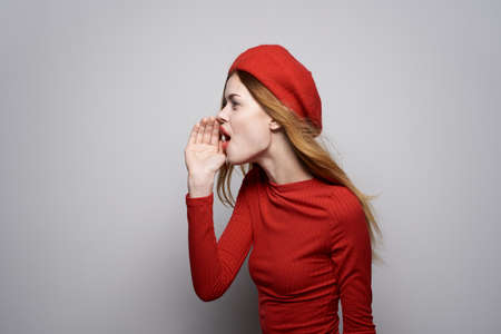 cheerful woman hand gesture fun Red lips luxury light backgroundの写真素材