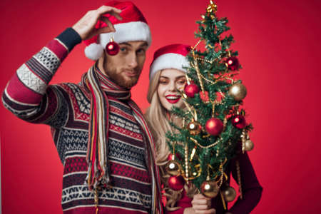 emotional young couple celebrating christmas decoration togetherの写真素材
