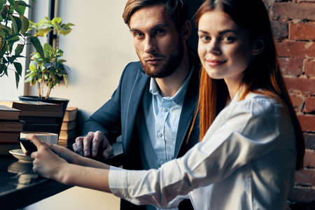 business man and woman in a cafe communication professionalsの写真素材