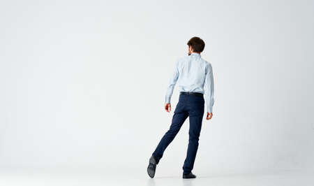 business man in suit posing full length isolated backgroundの写真素材