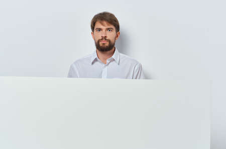 Cheerful man in a white t-shirt mocap poster discount advertising copy-space studioの写真素材