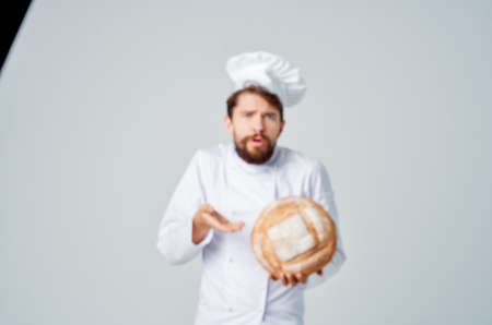 male cook restaurant provision of services light backgroundの写真素材