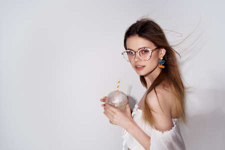 pretty woman wearing glasses cocktail drink attractive look luxuryの写真素材