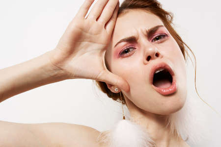 pretty woman with bare shoulders jewelry fashion posingの写真素材