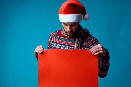 Cheerful man in New Years clothes advertising copy space isolated backgroundの写真素材