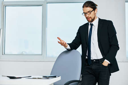 man in a suit near the desktop office computer Lifestyleの写真素材