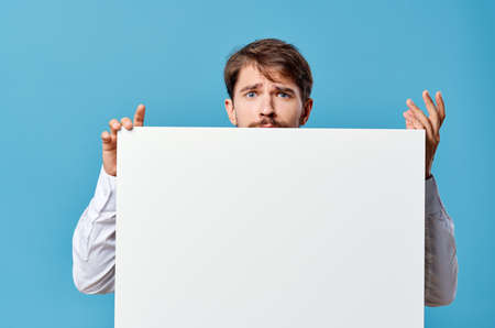 emotional man advertising white banner presentation Studioの写真素材
