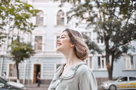 beautiful woman walking in red skirt outdoors Streetの写真素材