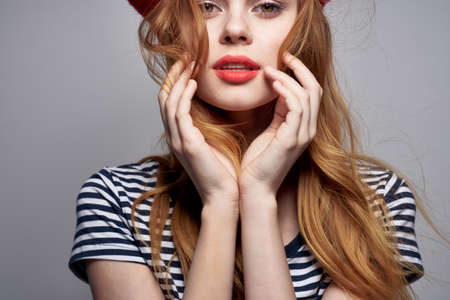 cheerful woman wearing a red hat makeup France Europe fashion posing Fresh airの写真素材