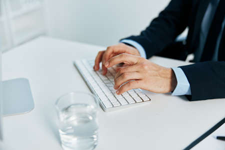 business man sitting at his desk computer office officialの写真素材