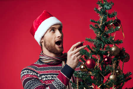 emotional man in New Years clothes decoration christmas studio posingの写真素材